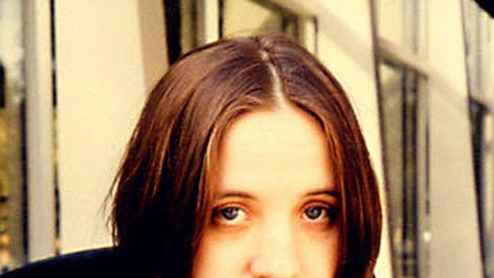 photo of a white woman with short dark hair and 