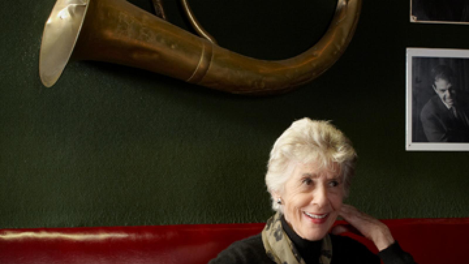 Photo of a woman sitting at a table