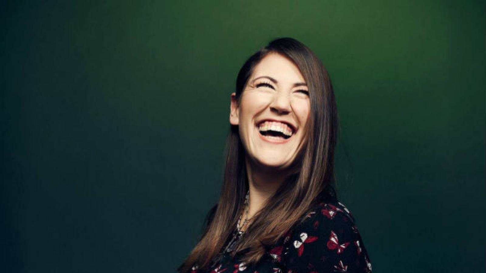 Portrait of woman with brown hair laughing