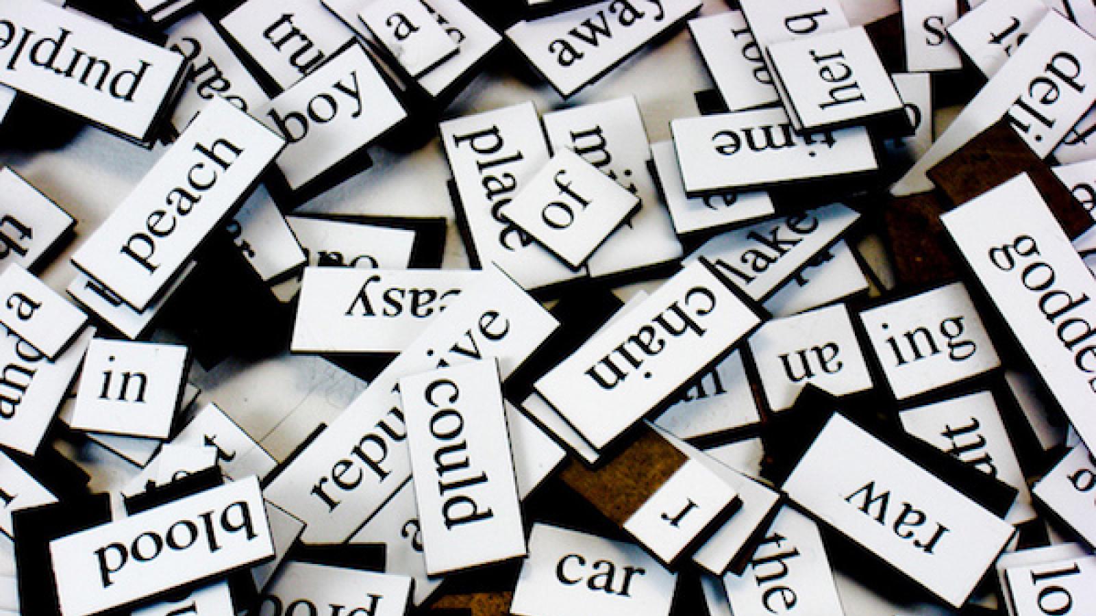 a pile of magnetic poetry fridge tiles