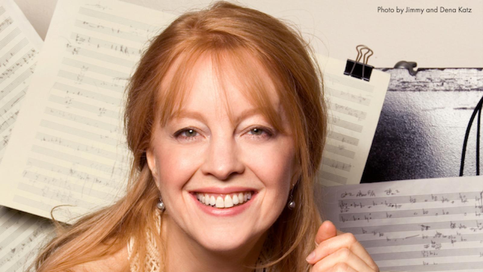 Composer Maria Schnedier against a background of music notation paper