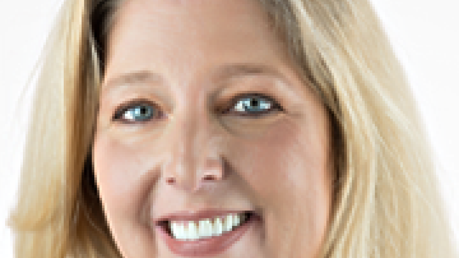 Headshot of a smiling woman with blonde hair