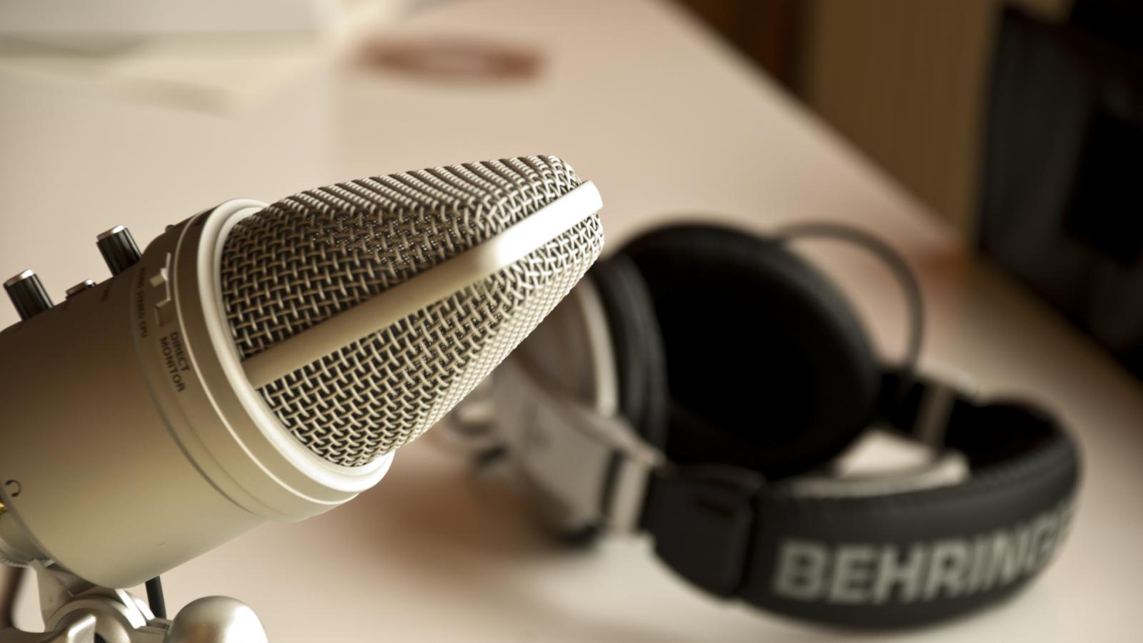 A microphone and headset in a studio.