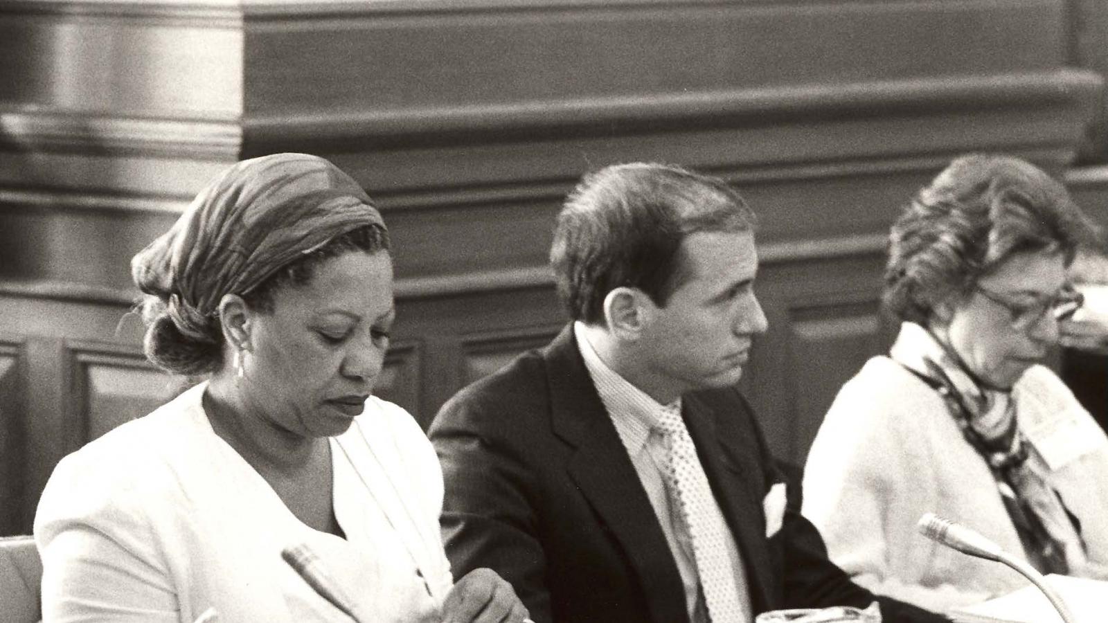 Toni Morrison reading applications at a meeting.