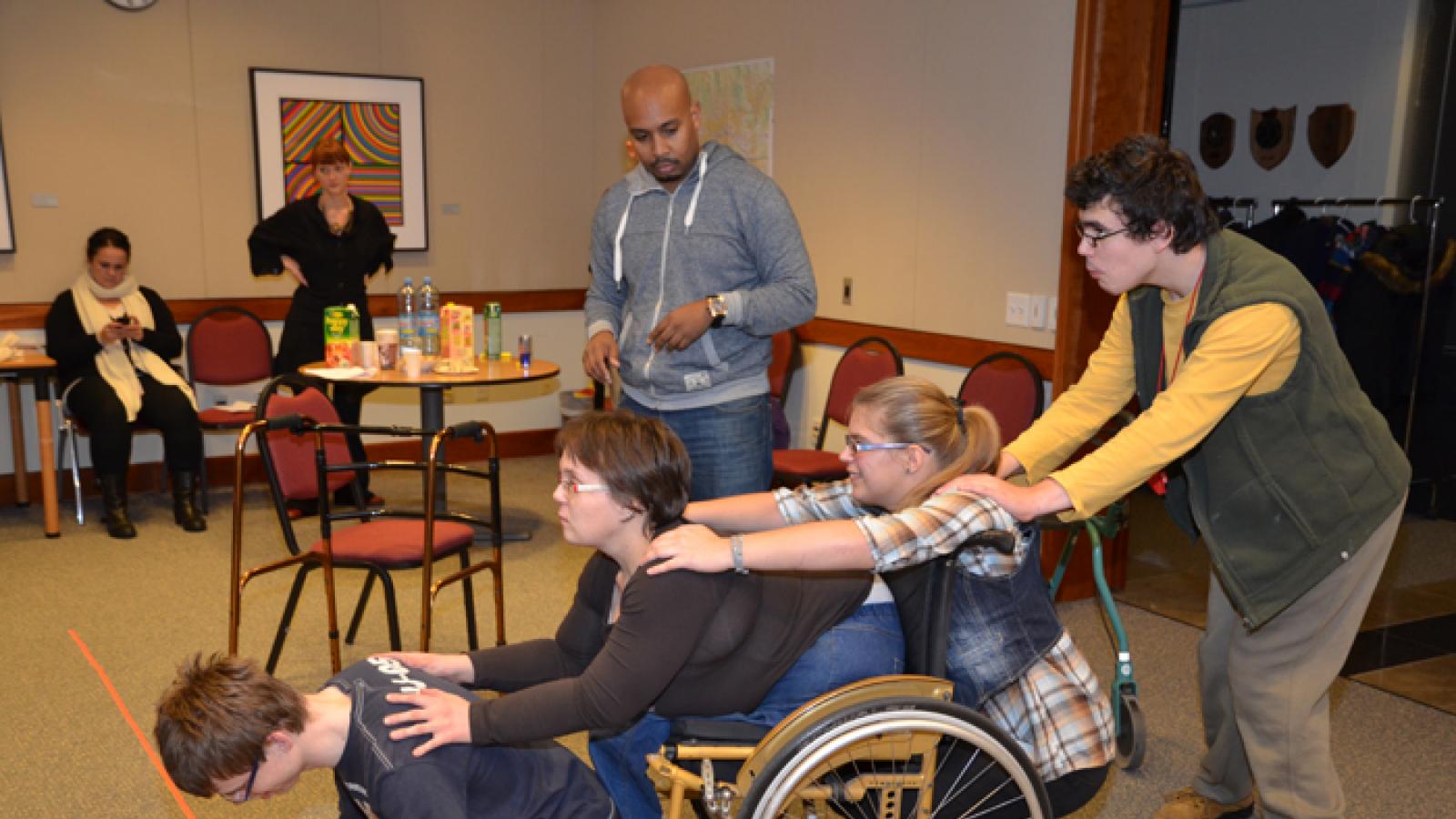 Group of disabled Croatian young adults practicing a play. 