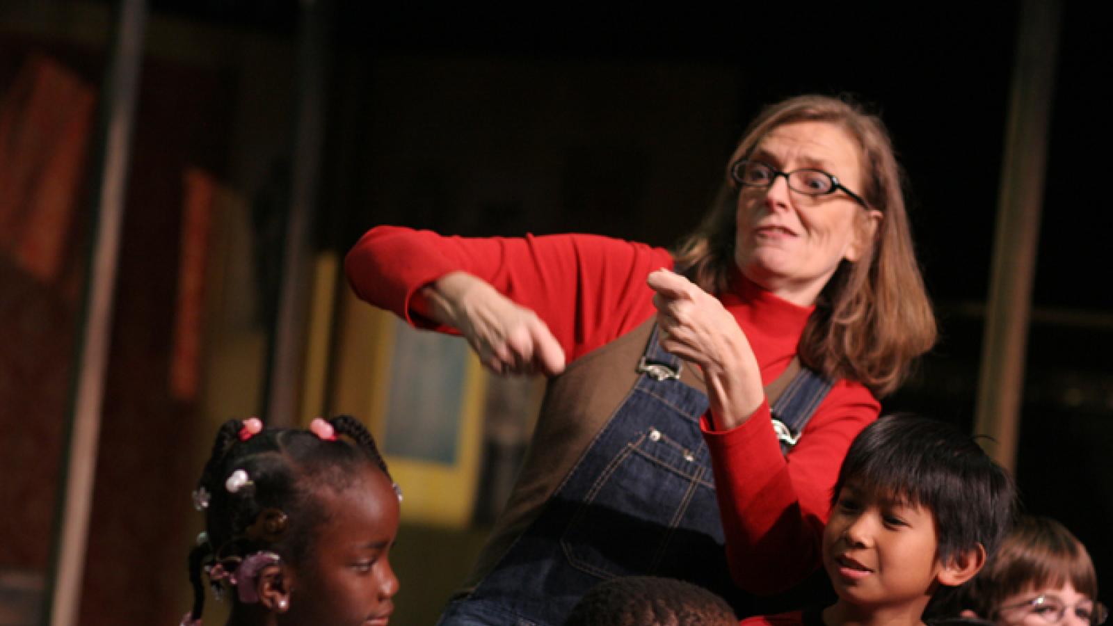 Deaf West’s Dramatic Gestures educational program A teacher sign languaging for students.