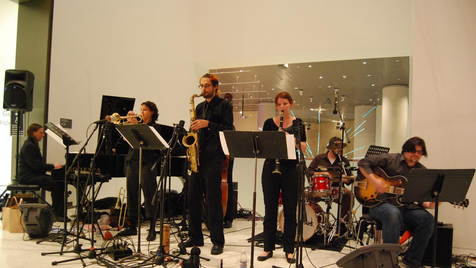 A band playing at a museum.