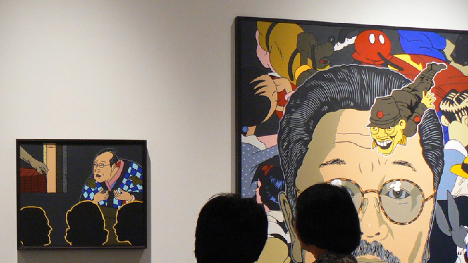 Wing Luke Museum exhibit. People looking at a museum exhibit.