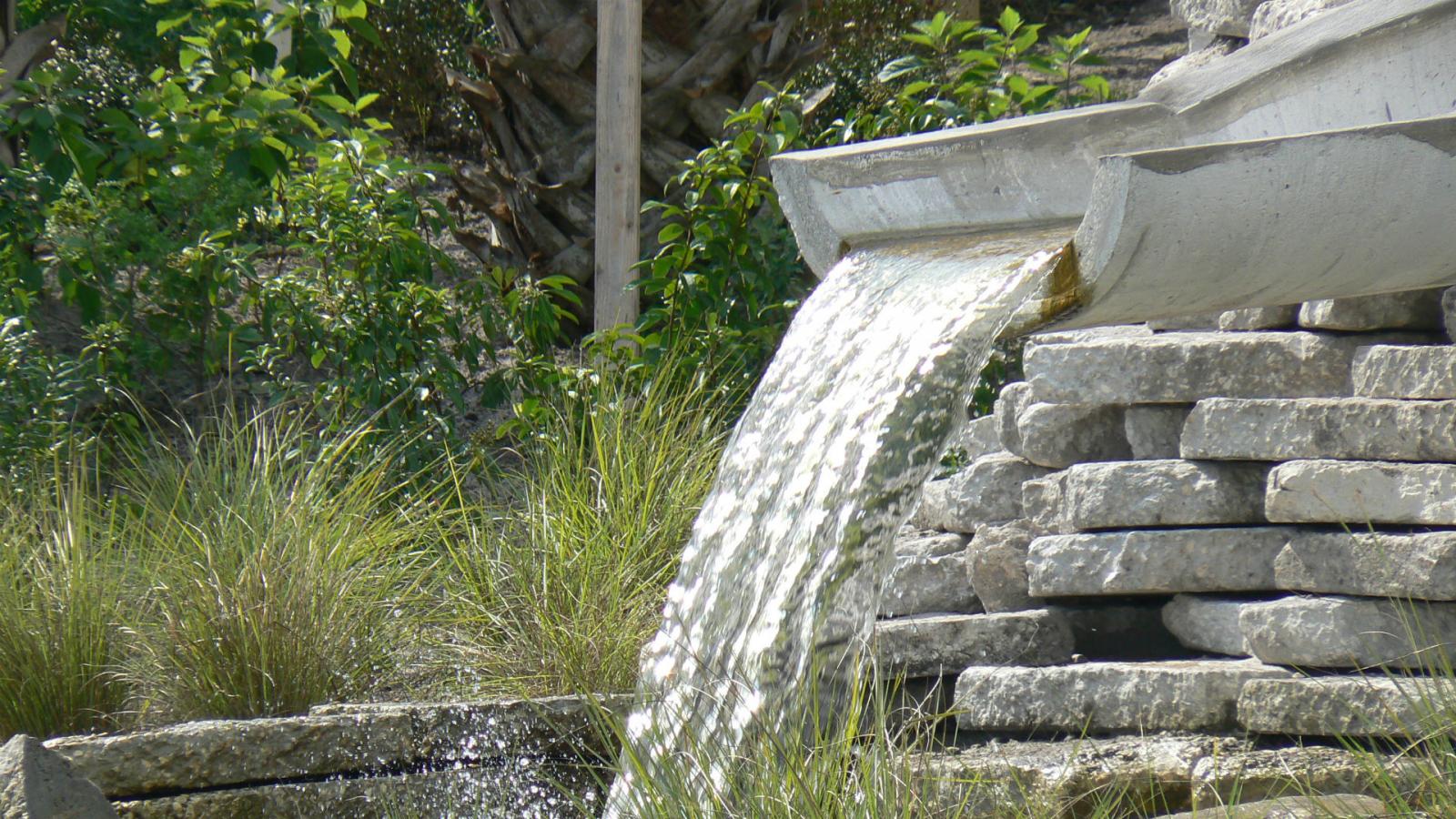 A fountain made of a cut stormwater pipe A fountain made of a cut stormwater pipe
