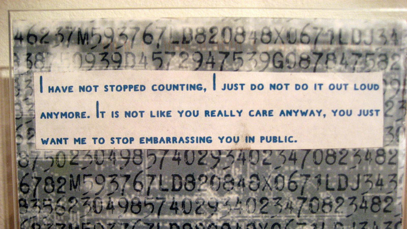 A postcard on museum display A postcard with a secret written on it
