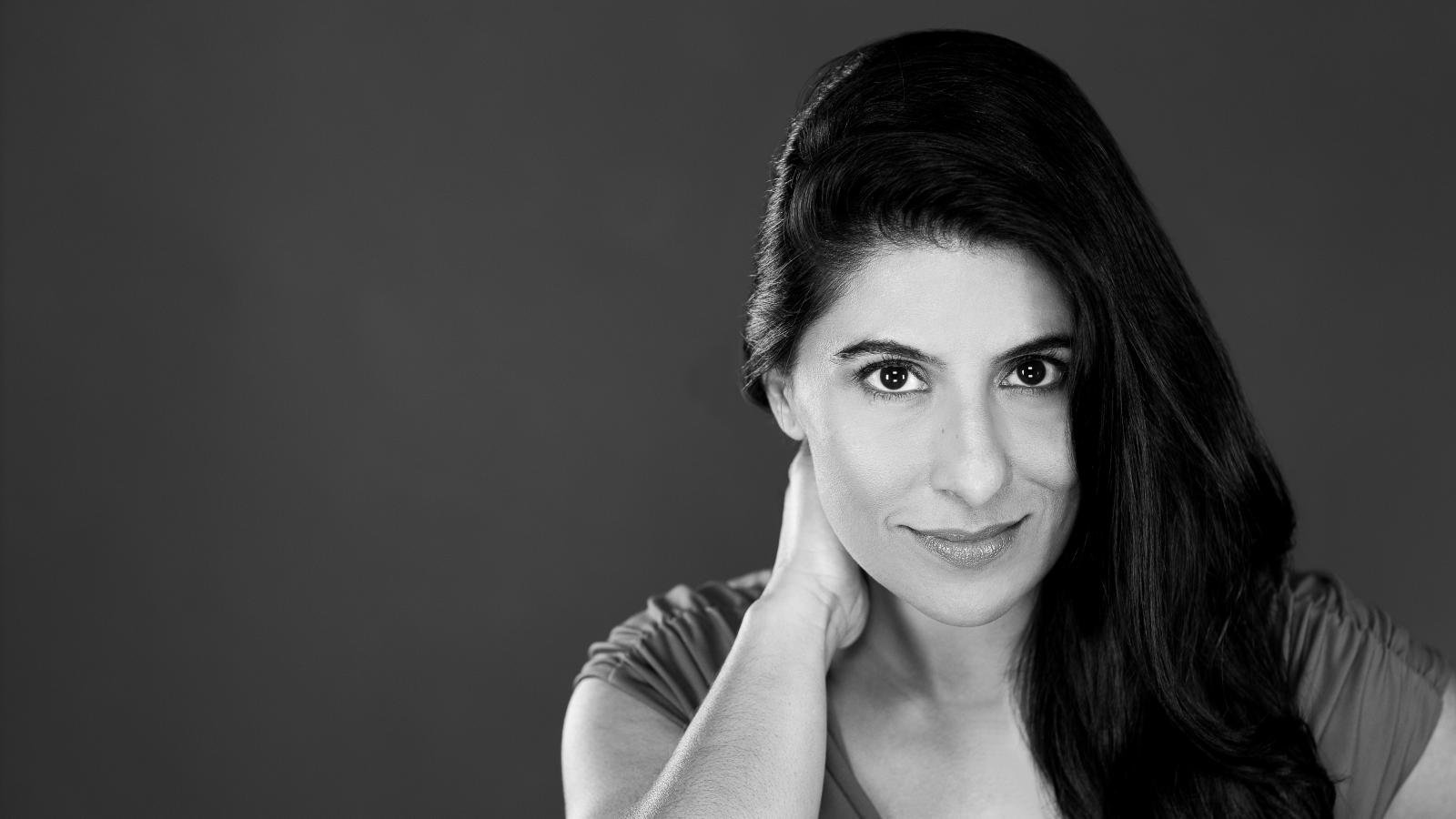 Head shot of a woman with long black hair