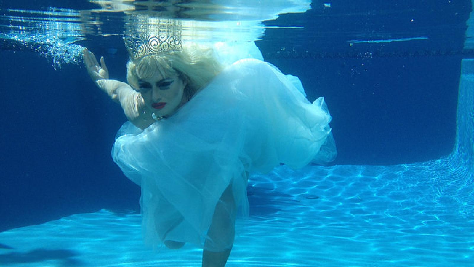 Drag queen in wedding dress underwater Drag queen in wedding dress underwater