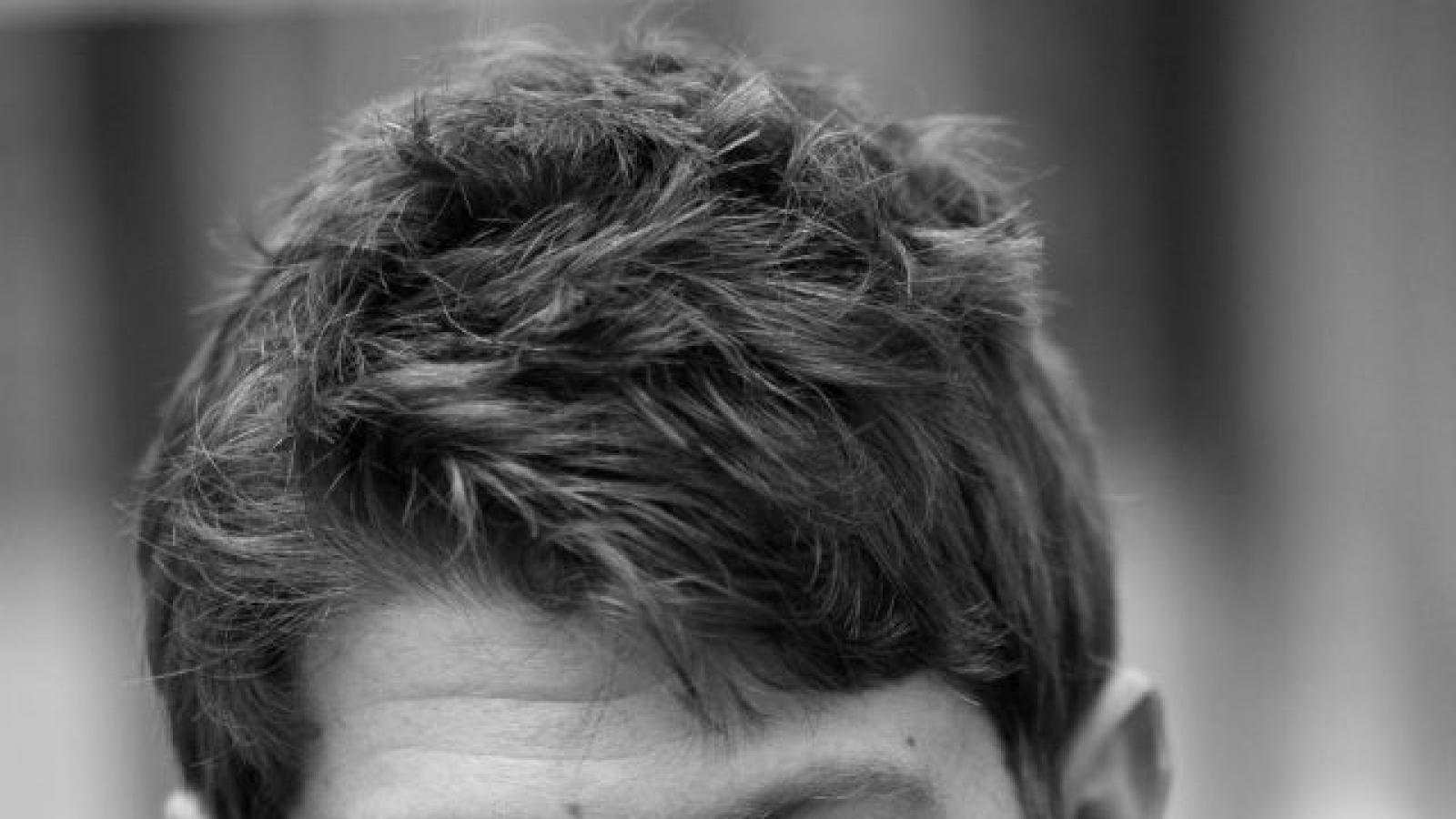 Adam Ehrlich Sachs Black and white head shot of young man