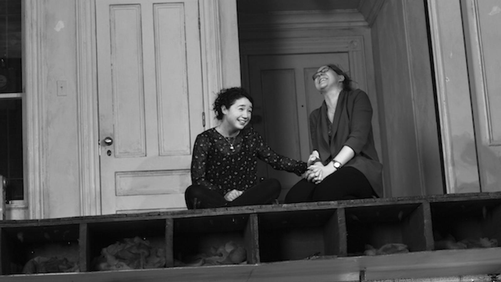 Brigid and Aimee Blake laughing/bonding on stage in The Humans