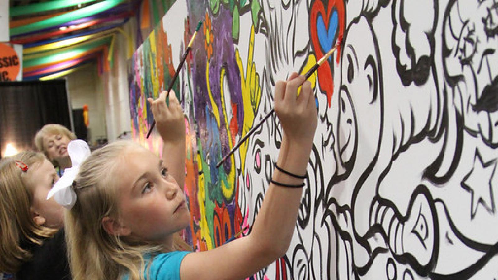 Children painting a mural