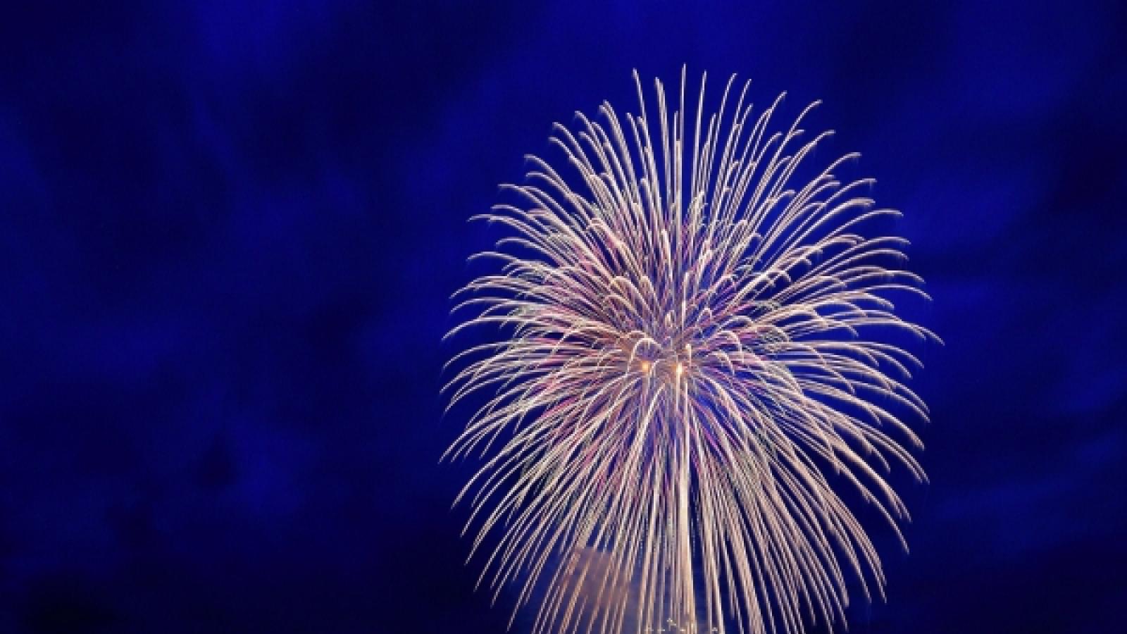An artist must be the kind of person that can change the world by way of transforming him or herself Zhou Zan quote over image of fireworks
