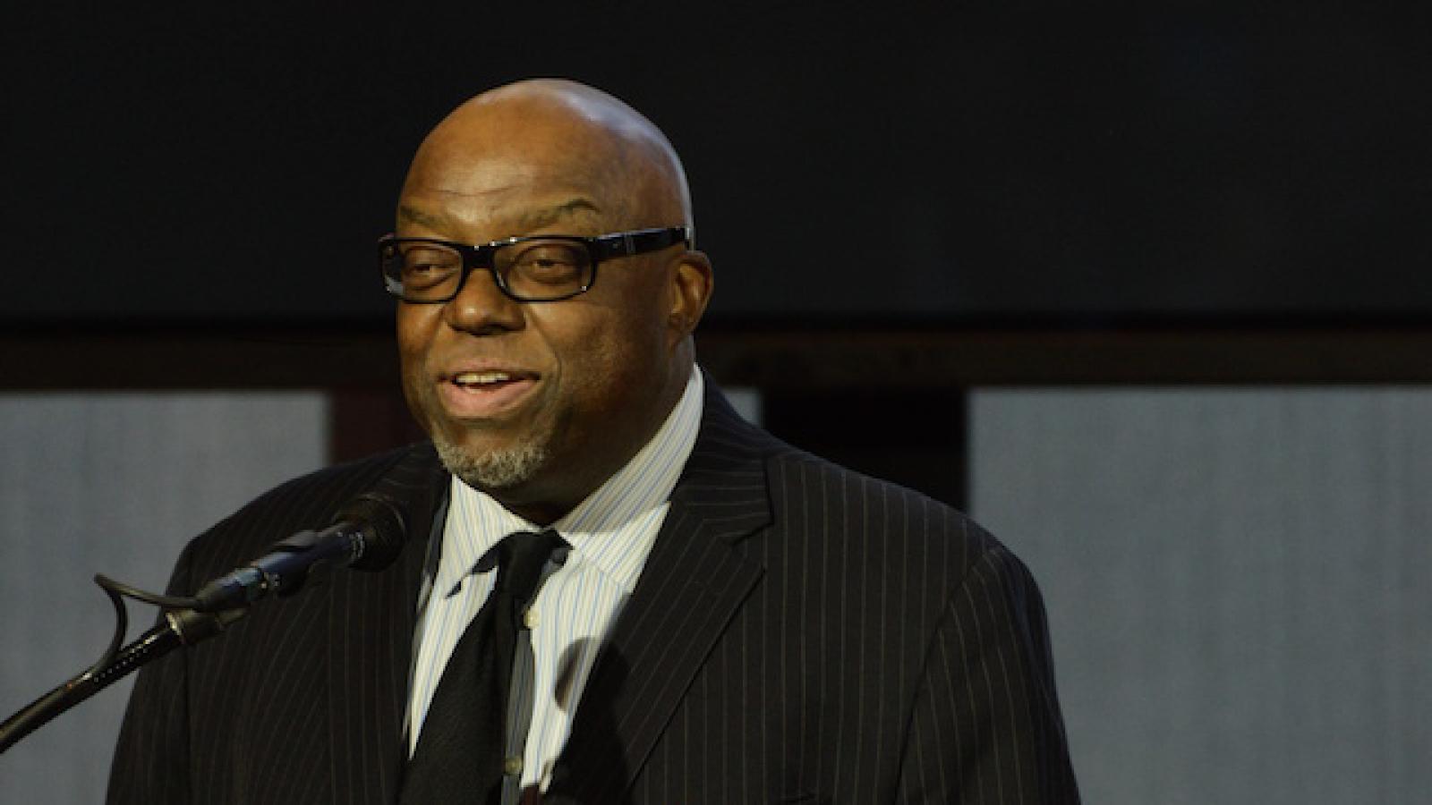 Stanley Crouch at a podium