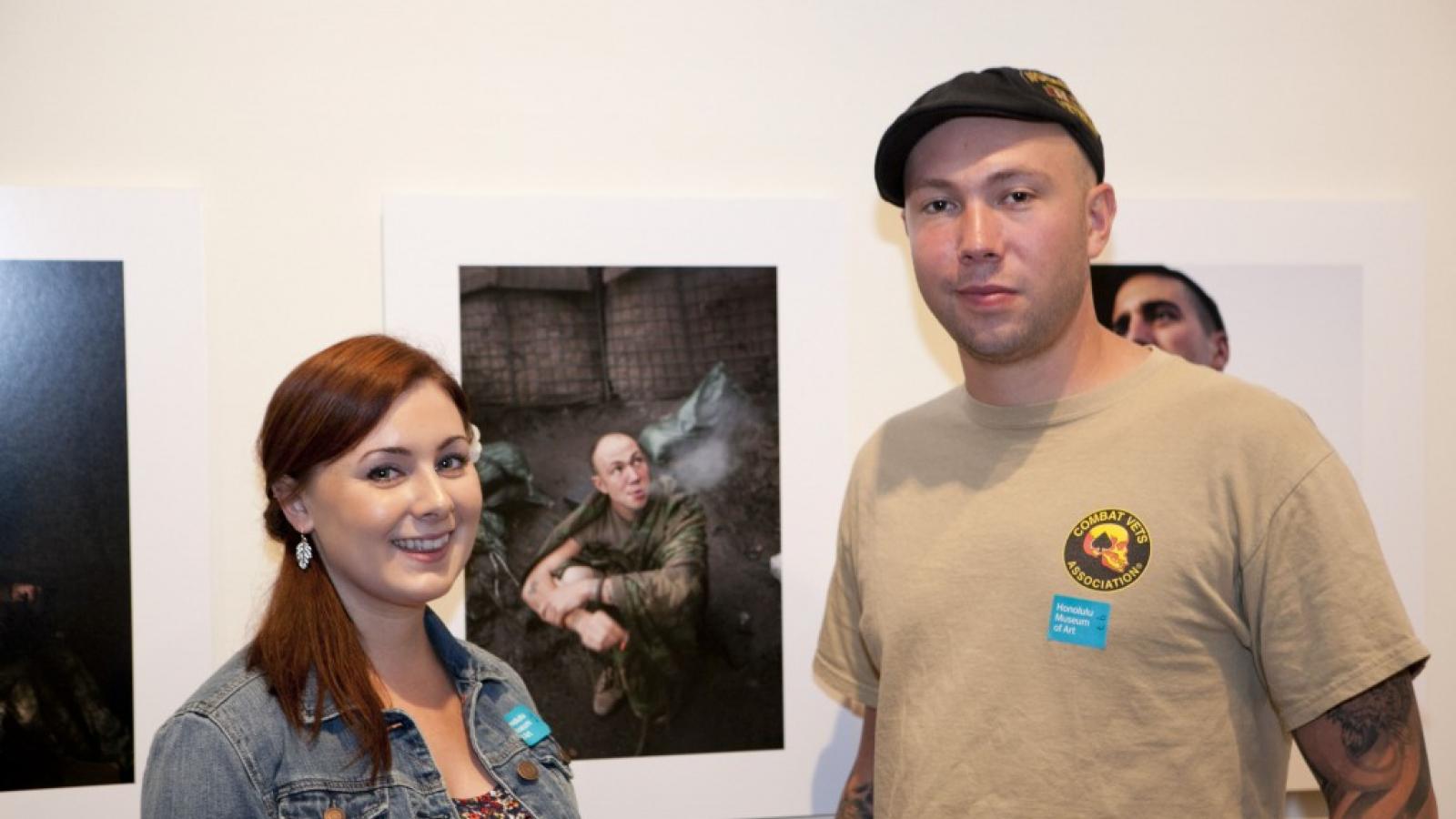Visitors attending the exhibit "Courage and Strength: Portraits of Those Who Have Served", which closed earlier this year at the Honolulu Museum of Art. Photo courtesy of the Honolulu Museum of Art