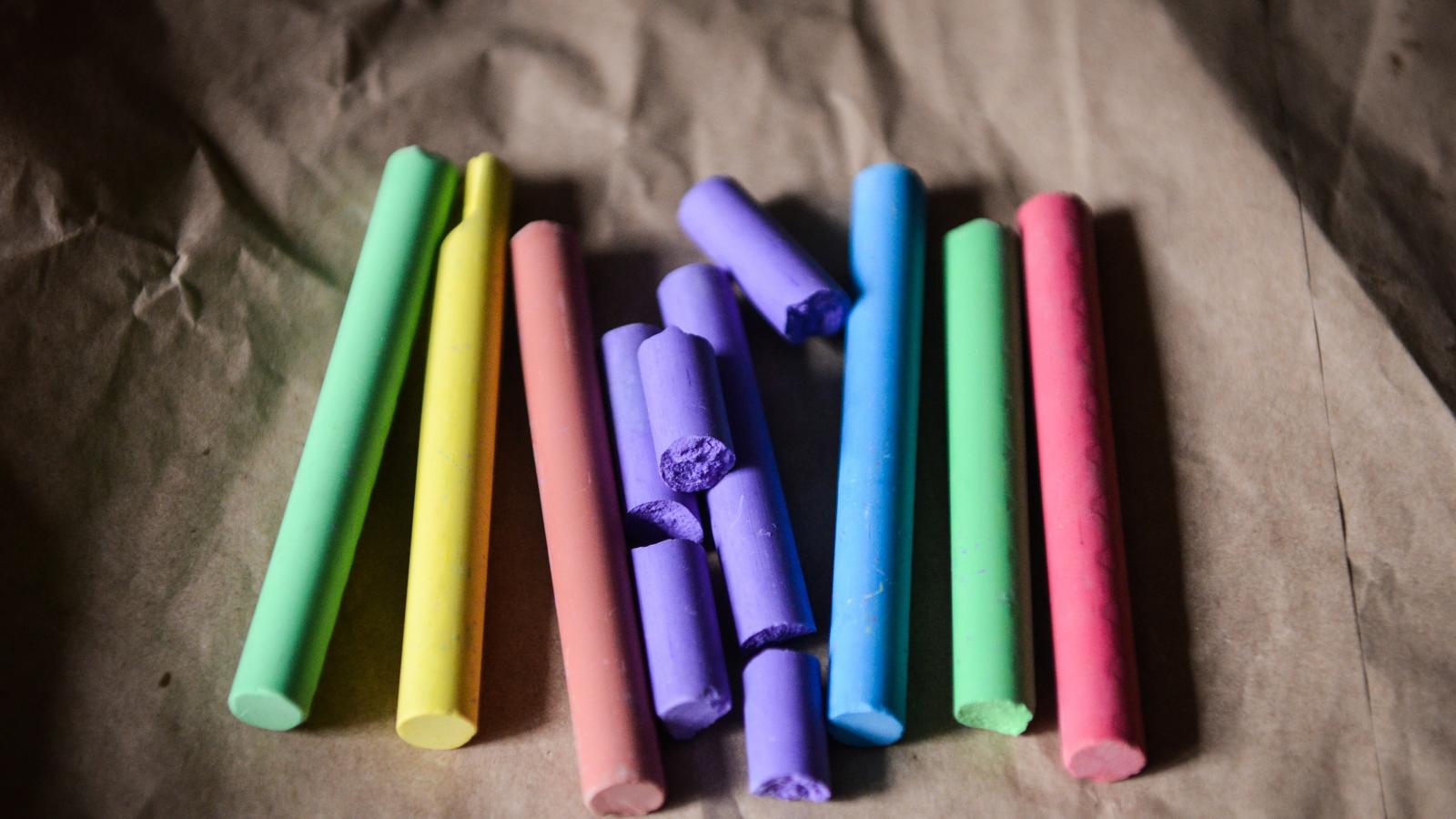 Four unique colored pieces of chalk.