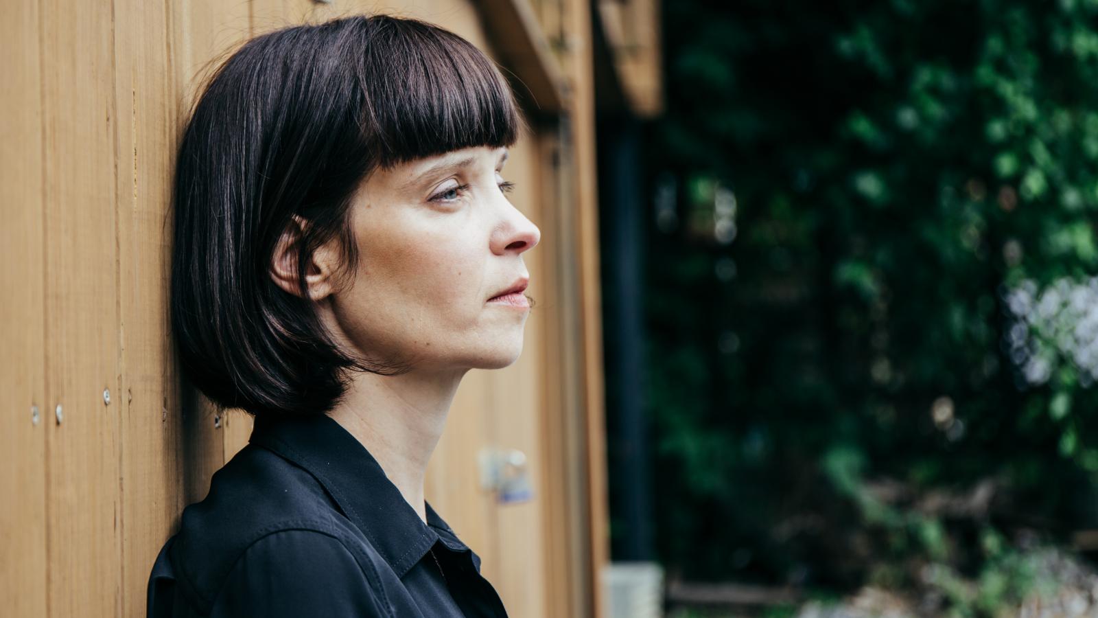 Profile shot of woman with short brown bob haircut