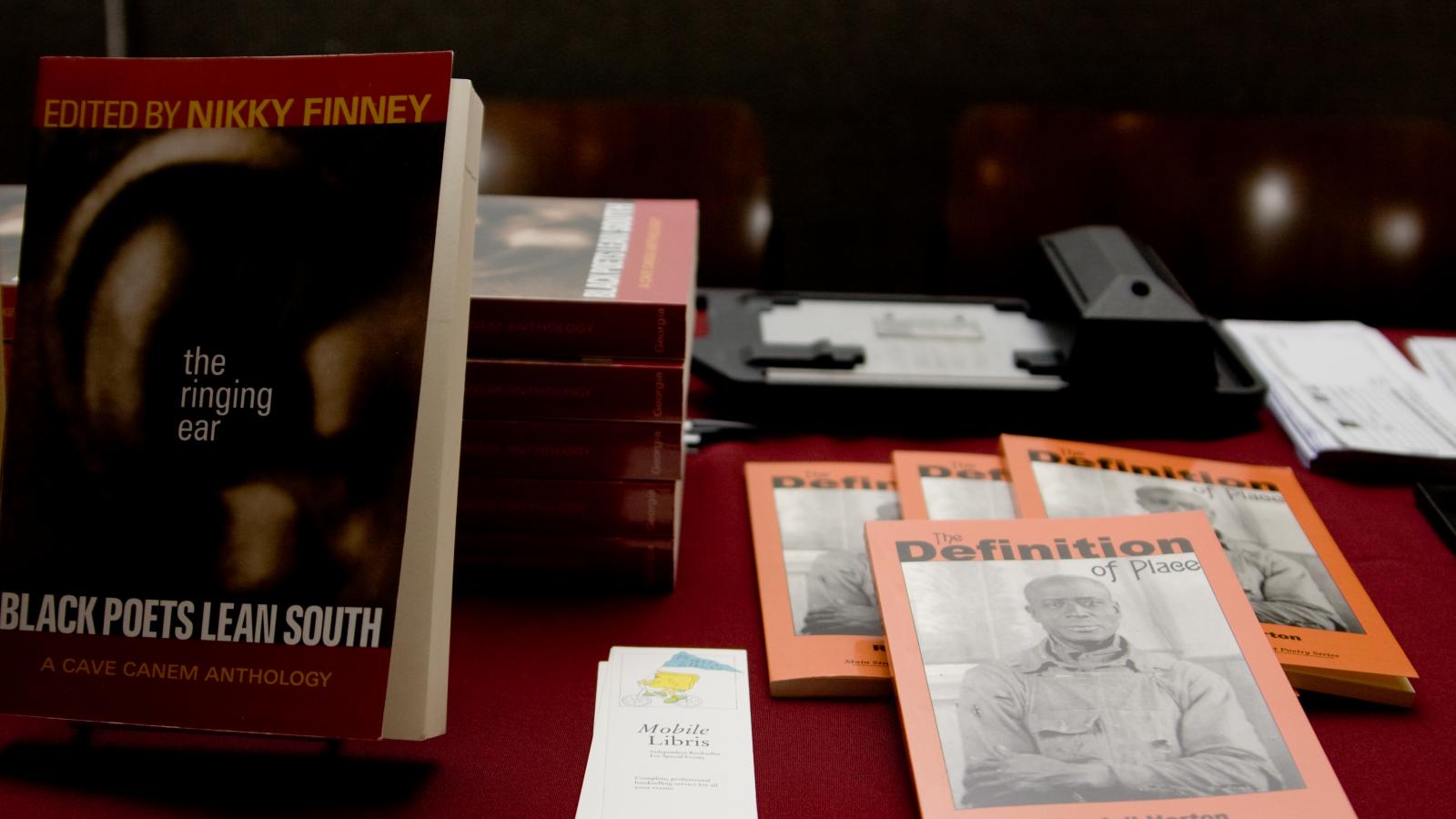 Books on display on a table.
