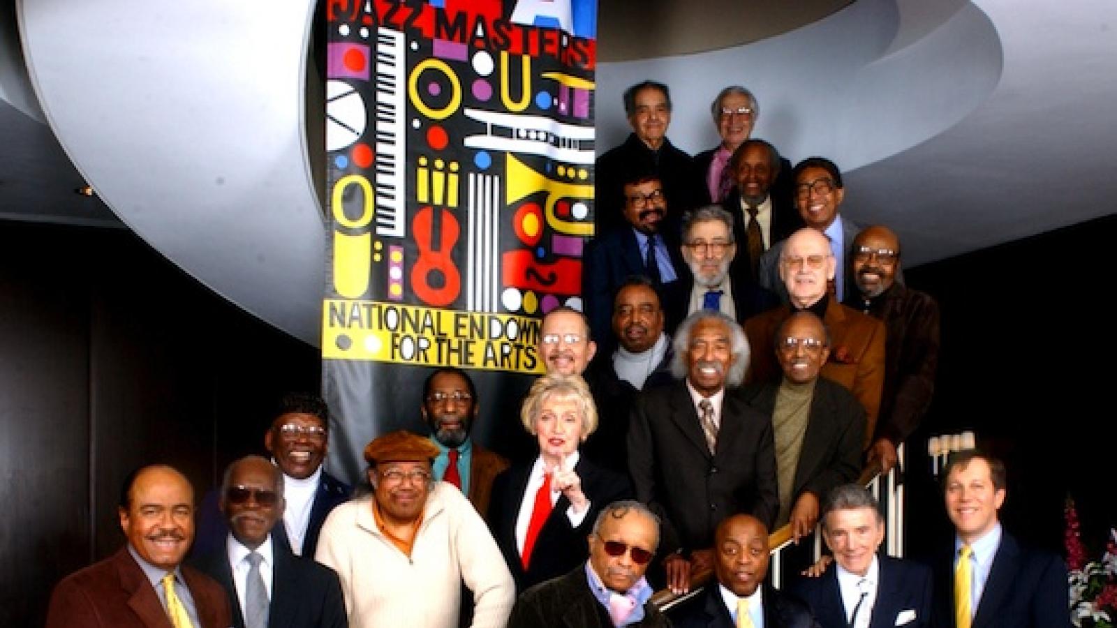 Group photo of 24 Jazz Masters with former NEA Chairman Dana Gioia