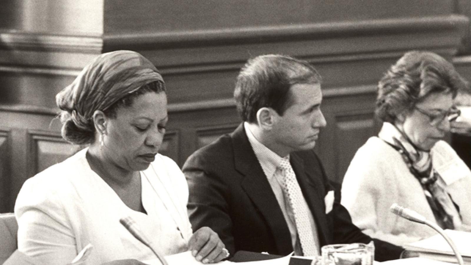 Author Toni Morrison with notebook and microphone serving as a panelist