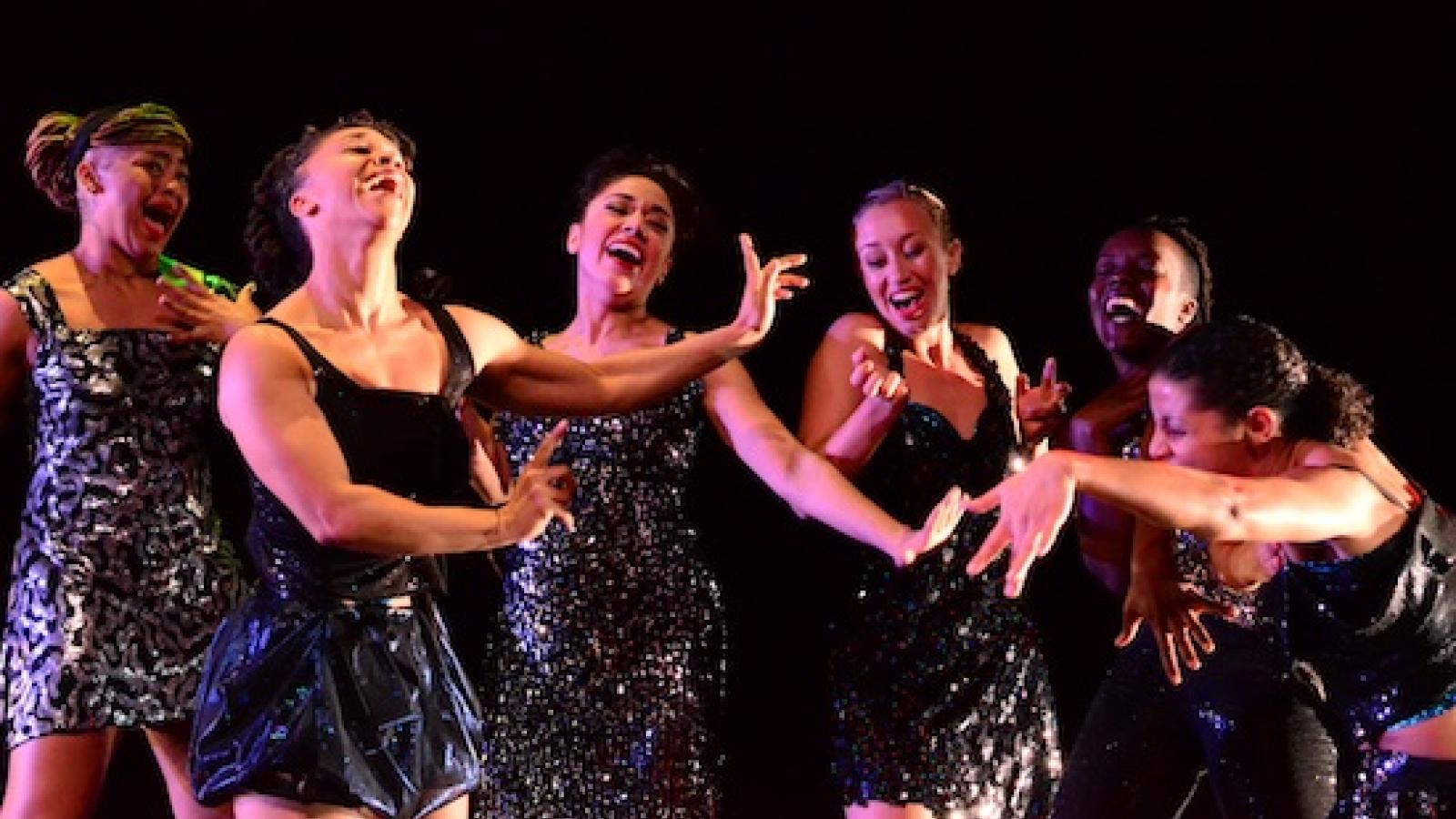 a group of women of color dancing