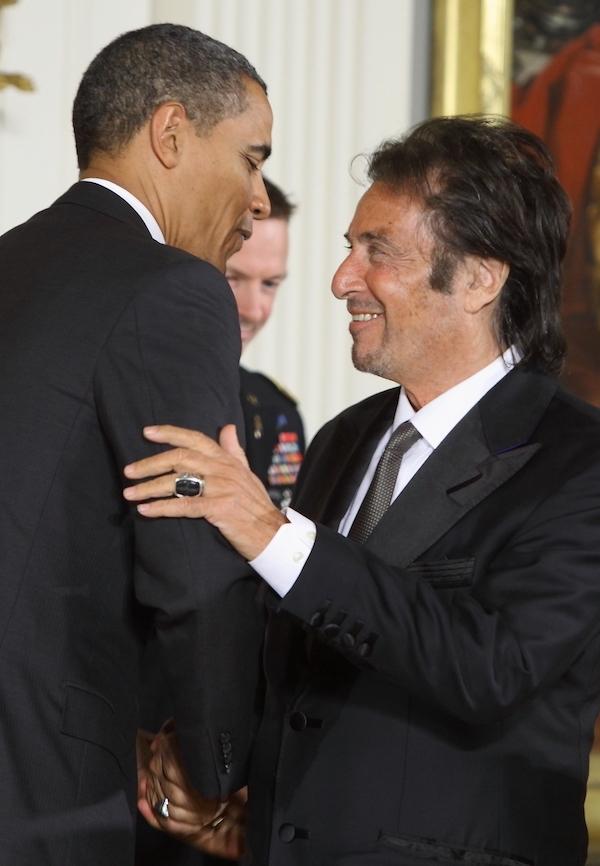 Two men embrace.