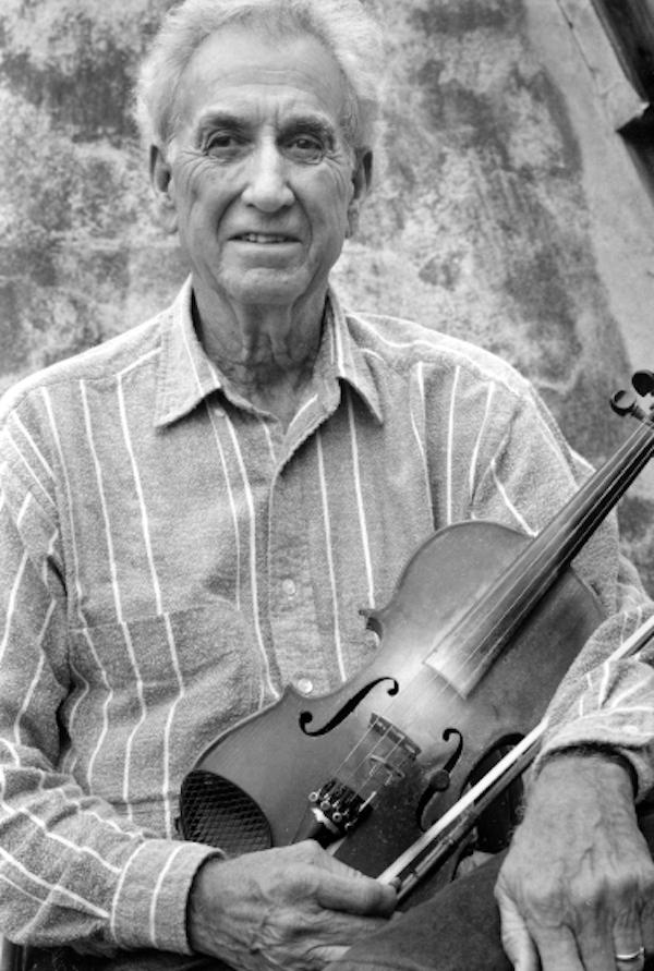 A man holding a fiddle.