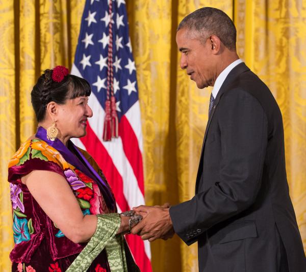 A man shakes hands with a woman