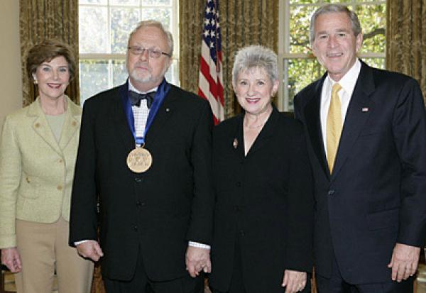 President Bush and Laura Bush with William Bolcolm and Joan Morris in the Oval Office