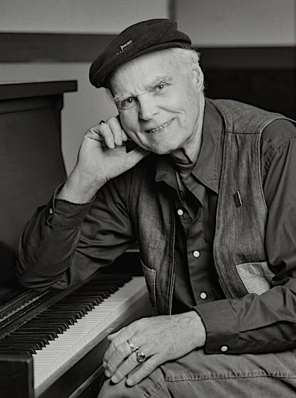 Portrait of Bob McQuillen sitting at the piano
