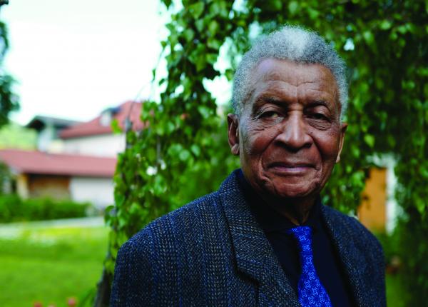 Portrait of man standing outside.