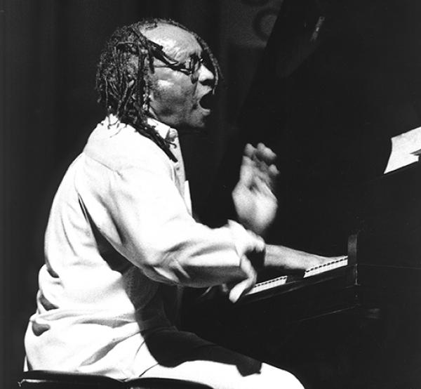 Man playing at piano