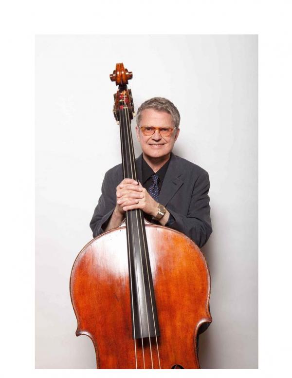 Man holding bass.