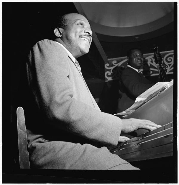 Man playing piano on stage. 