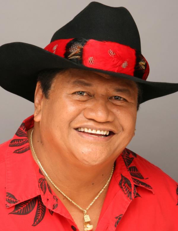 Portrait of man in black and red hat.