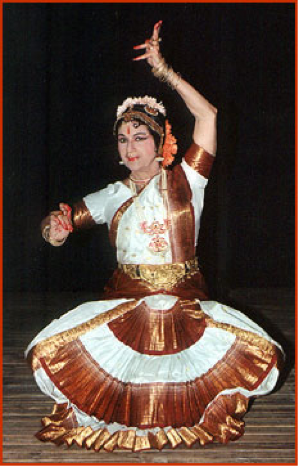 Woman in ethnic garb dancing.
