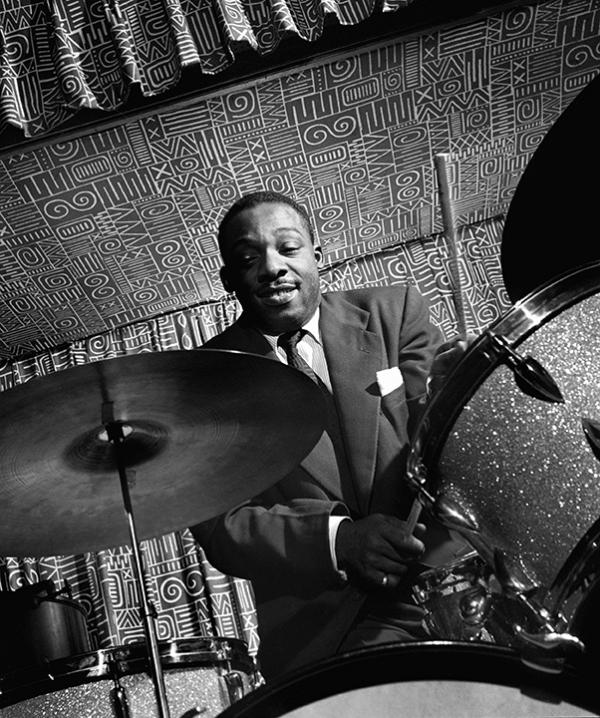 Man playing drums.
