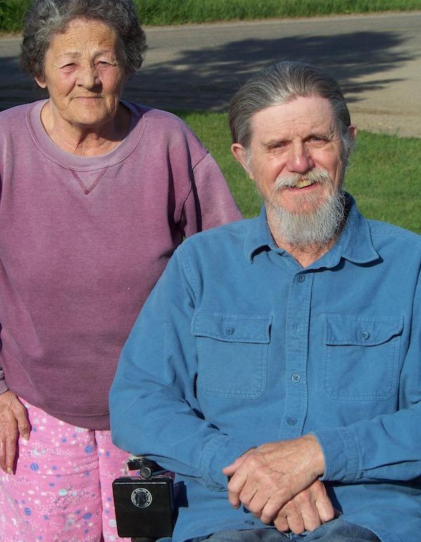 A man and a woman pose for the camera.