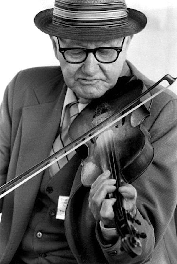 Man playing a fiddle.