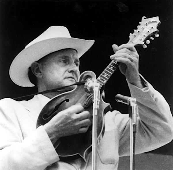 AS man playing a mandolin.