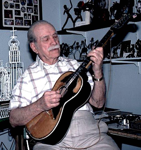 A man playing a guitar.