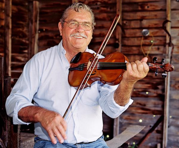 Man playing a fiddle.