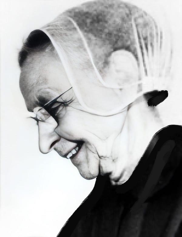 Headshot of a woman with a veil.