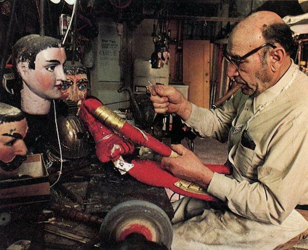 A man working on a puppet.