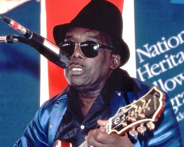 A man playing a guitar.
