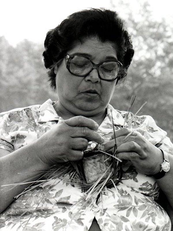 A woman making a basket.