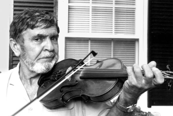 Man playing a fiddle.